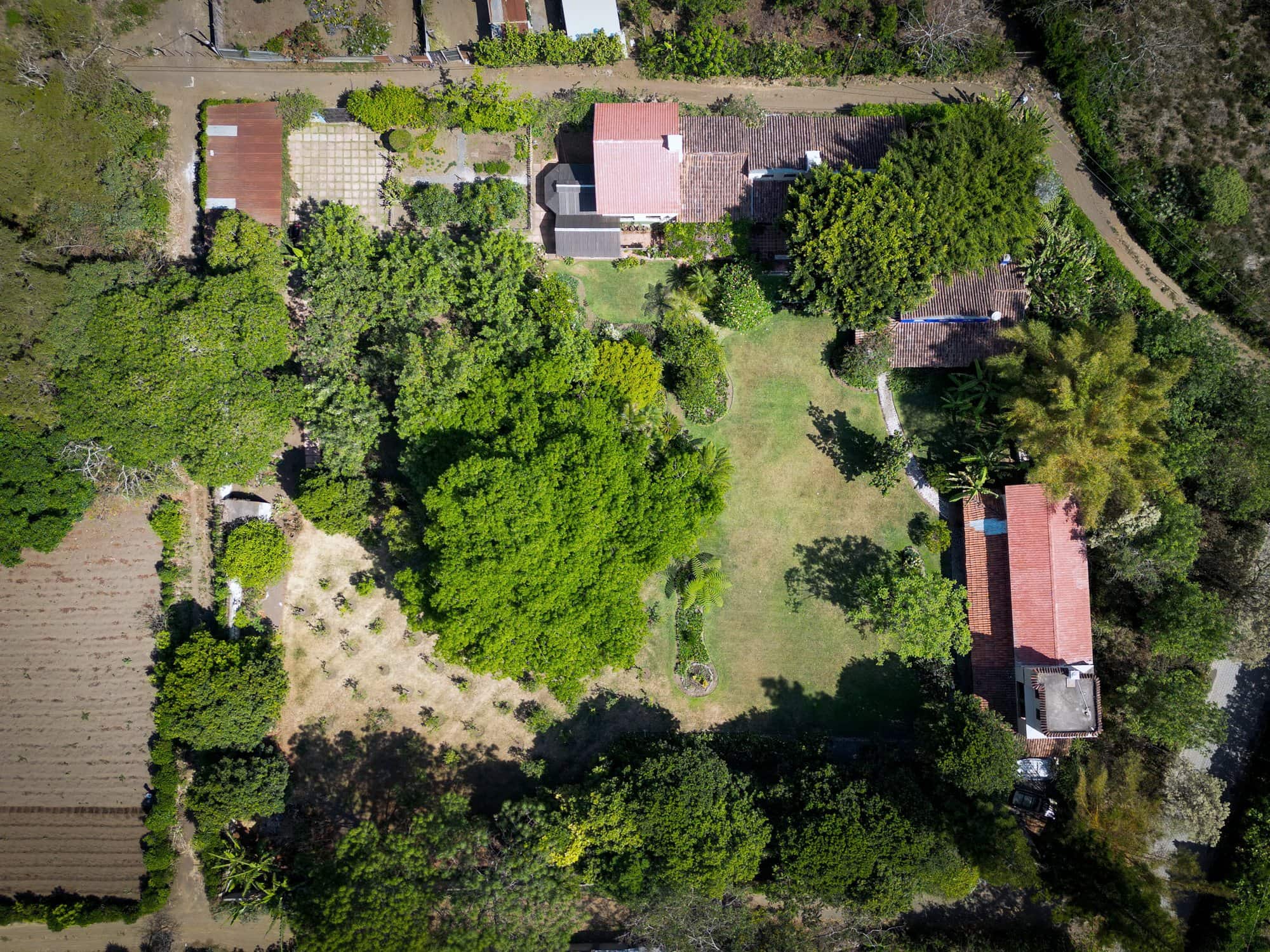 Overhead aerial of the estate showing the lawns, gardens and three residences